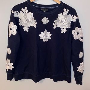 Blue Victoria Beckham sweater with white flowers